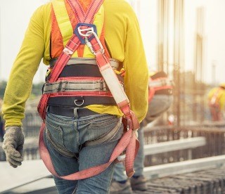 Construction workers with gear working in a safe building environment